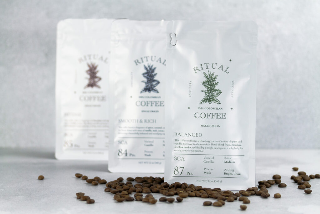 Three Ritual Specialty Coffee bags with roasted coffee beans