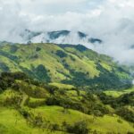 Green mountain ridges under low clouds