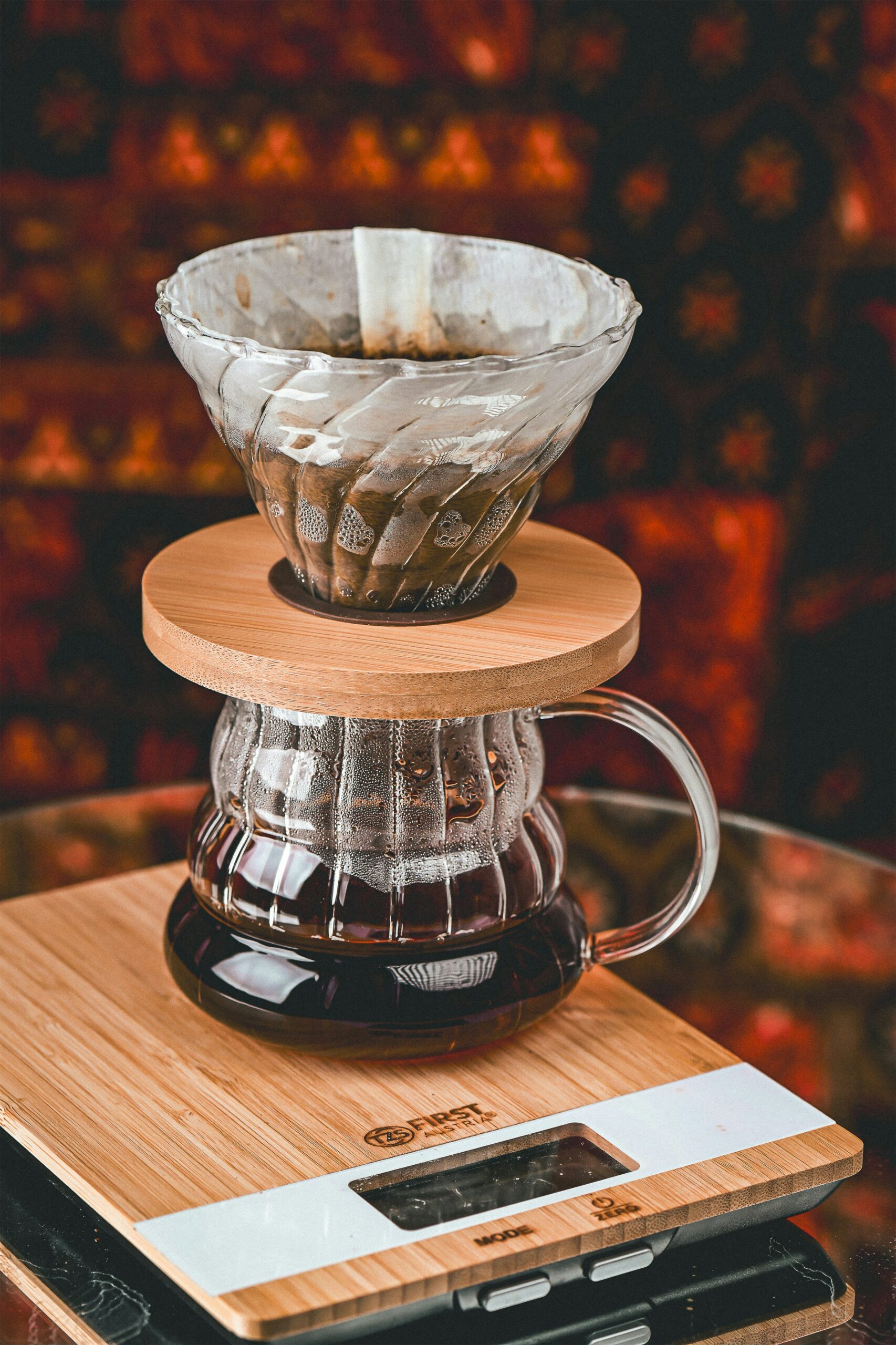 Pour-over dripper and glass server on a kitchen scale