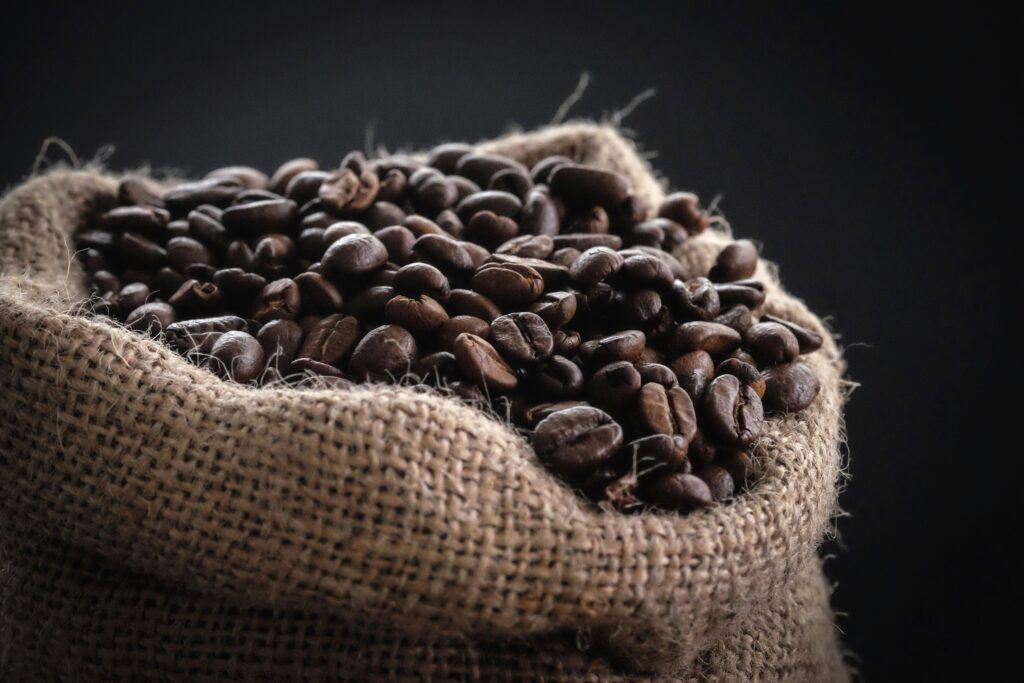 Burlap sack filled with roasted coffee beans
