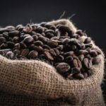 Burlap sack filled with roasted coffee beans
